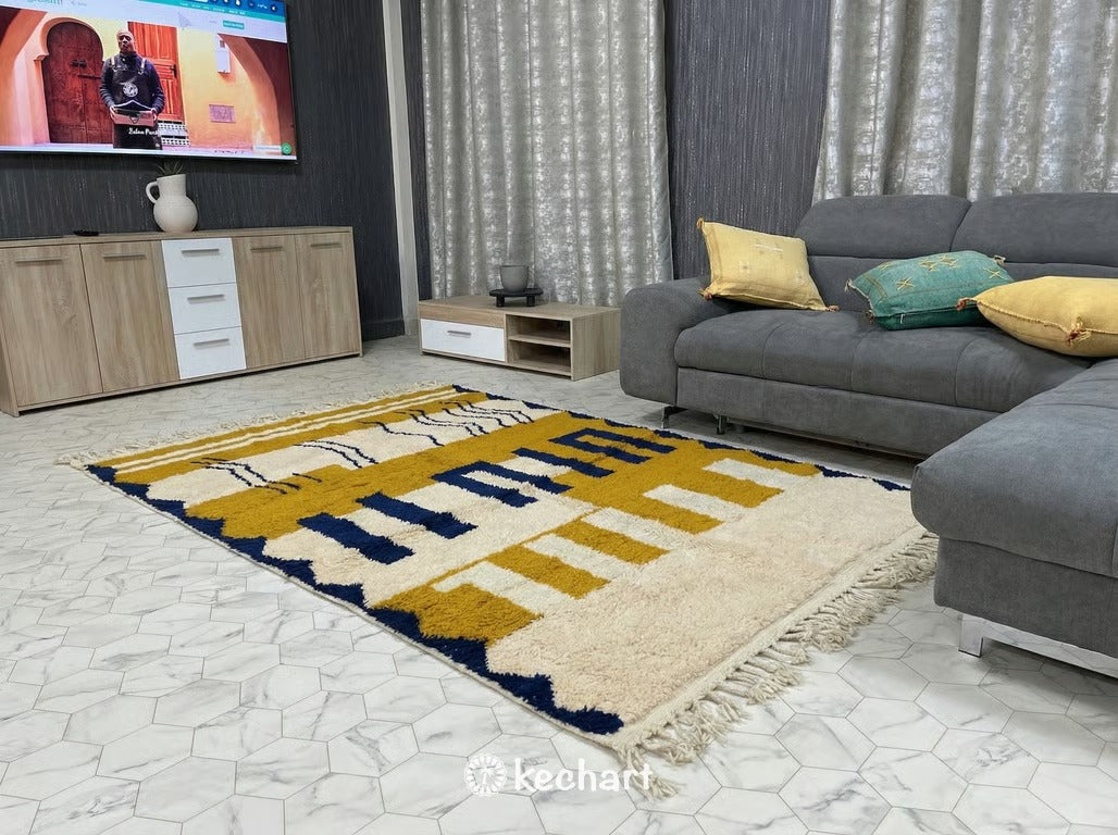 Expansive custom size Berber rug defining an open-plan living space with modern furniture, highlighting the handmade craftsmanship and warm palette.