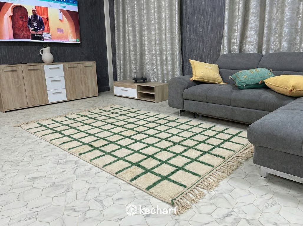 Close-up Detail of High Pile Beni Ourain Sheep's Wool Texture showing the thick Natural Cream yarns and the woven Russian Green geometric motifs.
