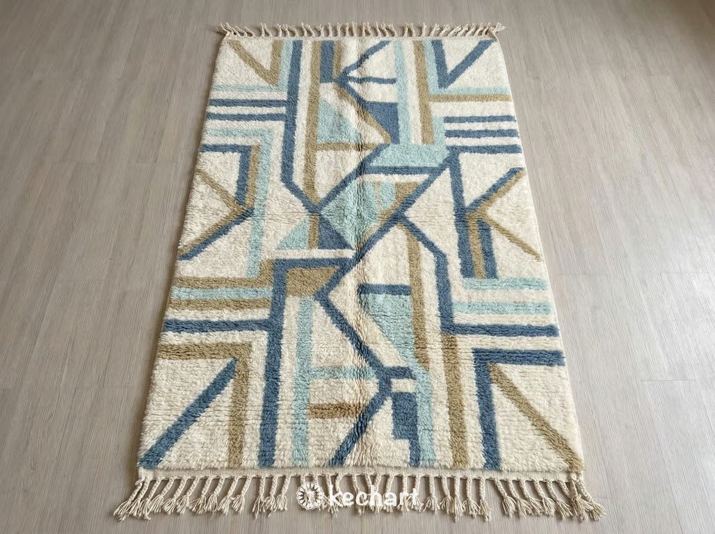 Custom Beni Ourain Moroccan Wool Rug showing plush texture in Dusty Blue, Aqua Haze, and Soft White geometric diamond pattern with traditional fringe.