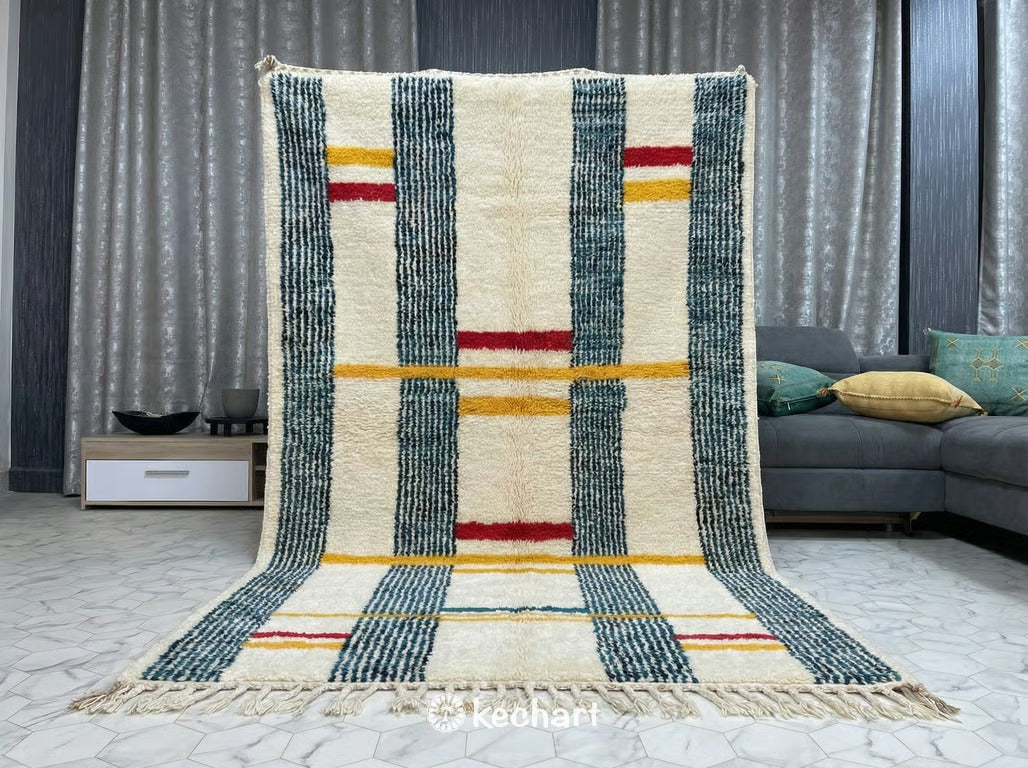 Vibrant geometric Beni Ourain rug used in a stylish nursery or children's playroom, providing a soft, non-toxic wool play surface with engaging red and blue diamond shapes.