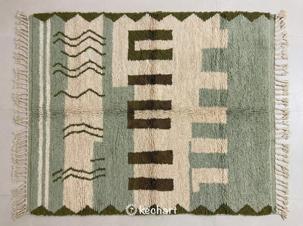 Flat lay view of custom Beni Ourain Moroccan rug showing plush wool texture in olive grove, sage green, raw umber, and classic beige geometric diamond patterns with traditional fringe.