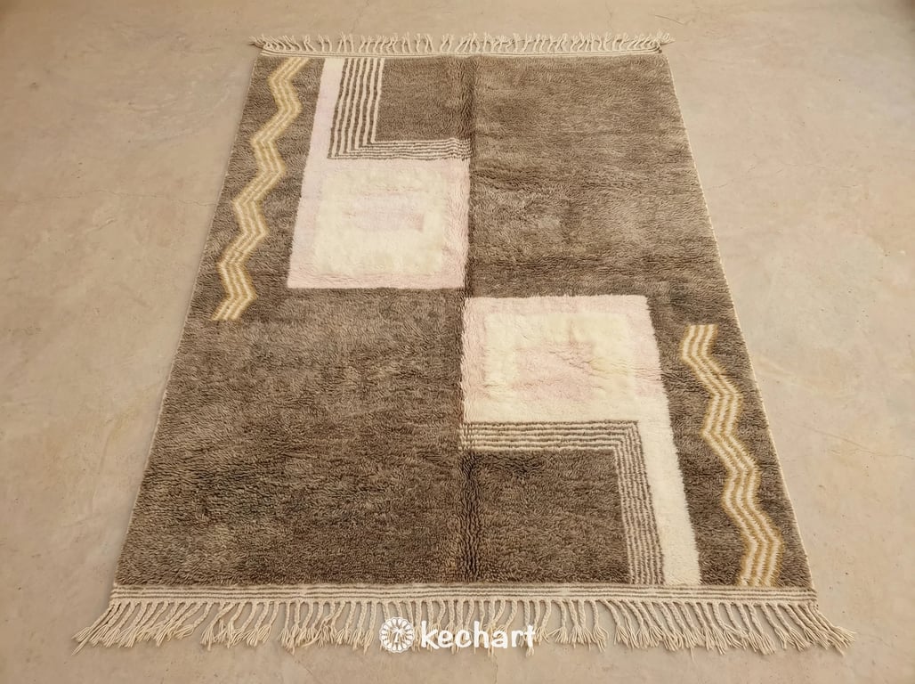 Custom made Beni Ourain Moroccan rug flat lay showing plush cream and beige wool texture with medium density geometric diamond pattern and traditional fringe.