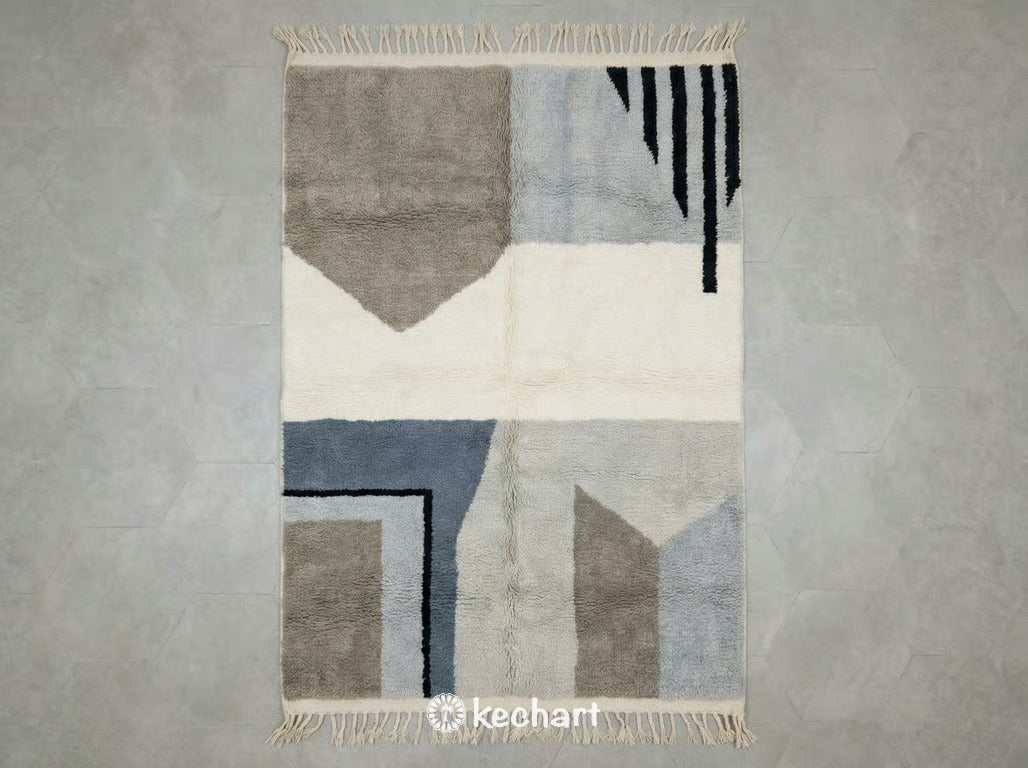 Custom made grey Beni Ourain Moroccan wool rug showing plush shaggy texture and geometric diamond pattern in slate and soft white tones with traditional fringe.