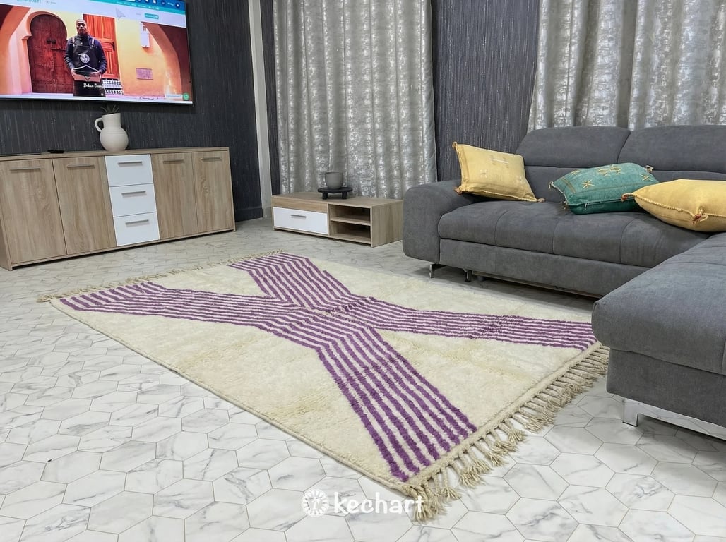 Close-up detail shot of hand-knotted Moroccan wool fibers, showing the high pile texture and the rich viola color of the diamond pattern against the natural cream base.