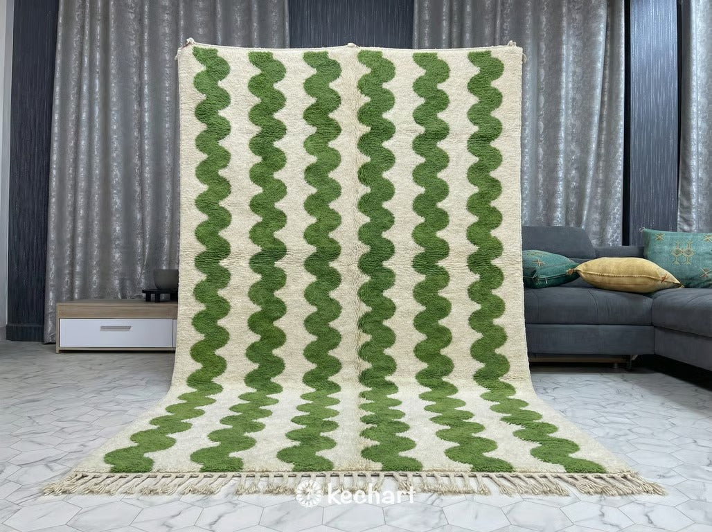 Plush shaggy Beni Ourain rug placed under a large bed in a serene, neutral master bedroom, adding texture and a pop of green color.