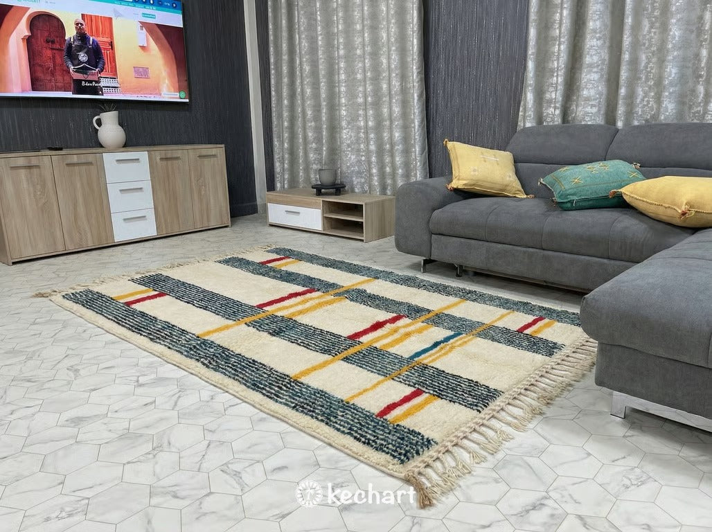 Vibrant geometric Beni Ourain rug used in a stylish nursery or children's playroom, providing a soft, non-toxic wool play surface with engaging red and blue diamond shapes.