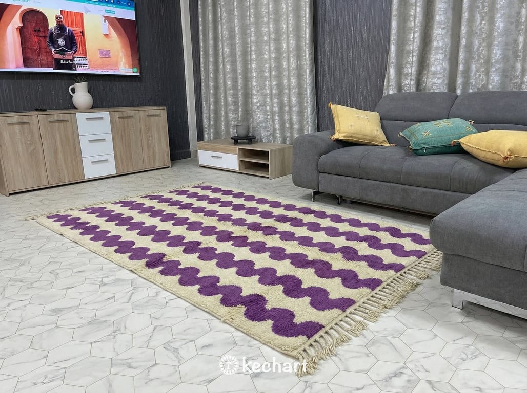 Large Beni Ourain shag rug placed under a bed in a serene master bedroom, adding texture and pops of orchid color to a minimalist design scheme.