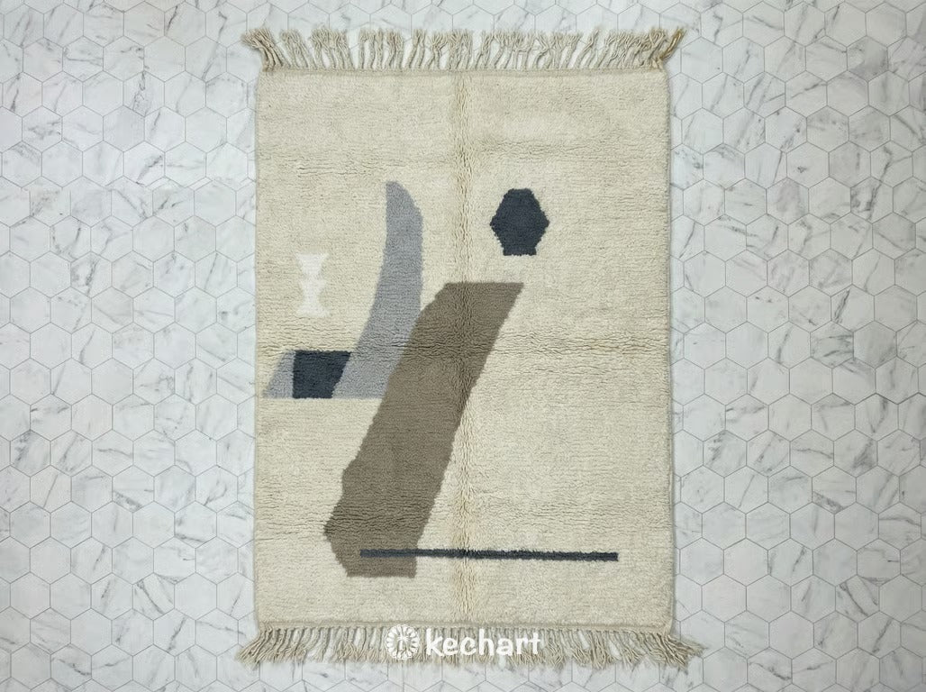 Custom made-to-order Beni Ourain Moroccan rug featuring plush grey, silver, and soft white wool with a medium density geometric diamond pattern and traditional fringe.