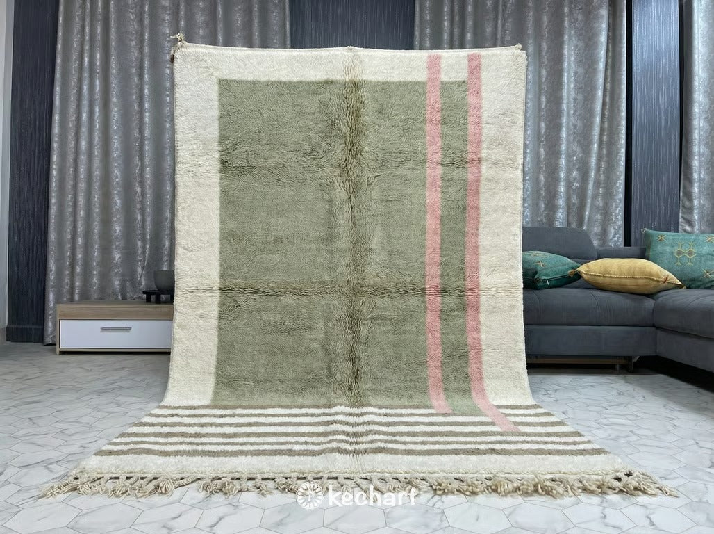 Close-up detail of the hand-knotted wool pile and traditional fringe of a made-to-order Beni Ourain rug, highlighting artisanal quality and soft color palette.