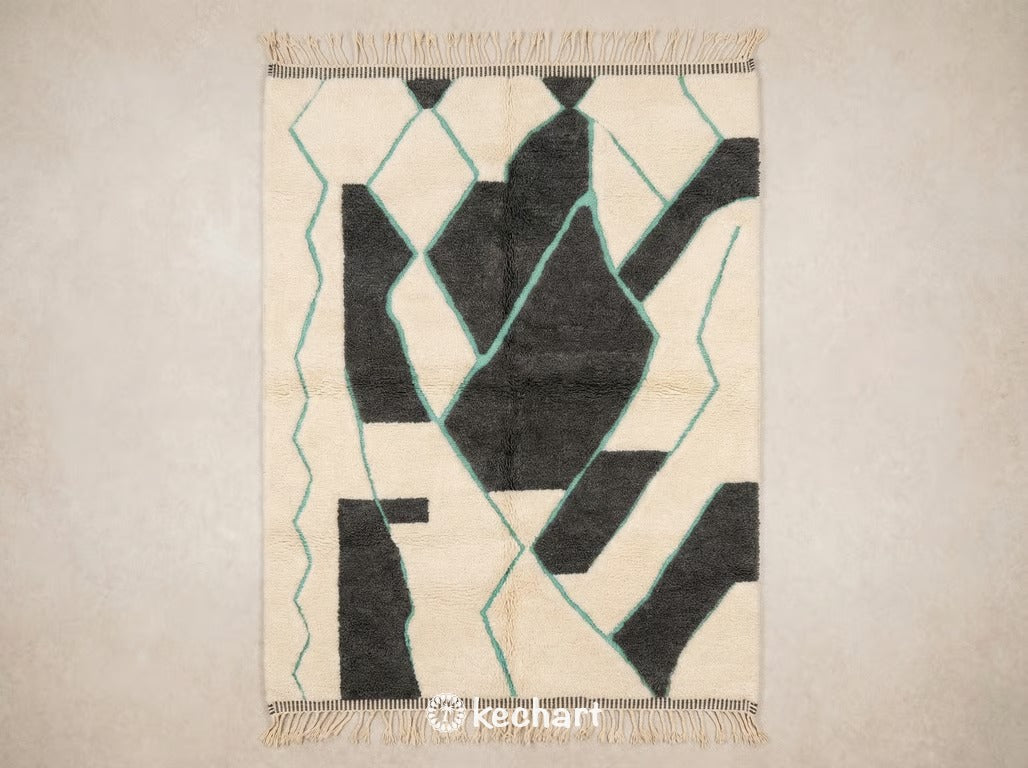 Flat lay view of a custom made-to-order Beni Ourain Moroccan rug showing plush cream wool texture with charcoal grey and mint turquoise geometric diamond patterns.