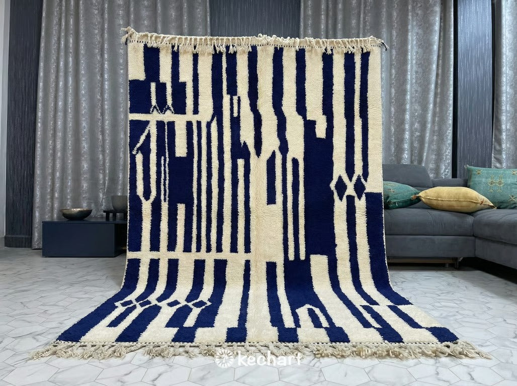 Large custom Beni Ourain area rug anchoring a modern living room with a neutral linen sofa, wooden coffee table, and bohemian decor accents.