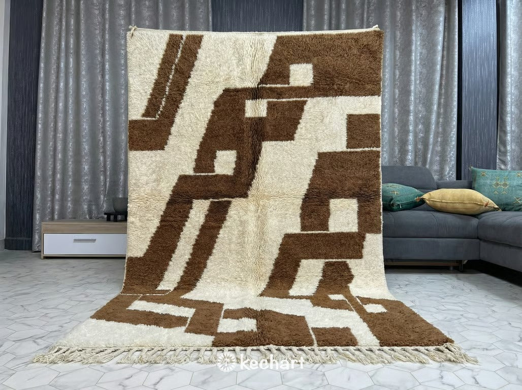 Close-up view of the thick, luxurious shaggy wool pile texture and hand-knotted craftsmanship of a cream and toffee Beni Ourain custom rug.