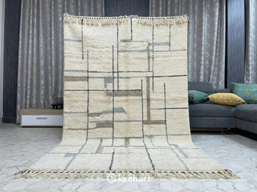Custom size geometric Moroccan rug in soft grey and white used as a cozy statement piece in a Scandi-style nursery or modern home office.