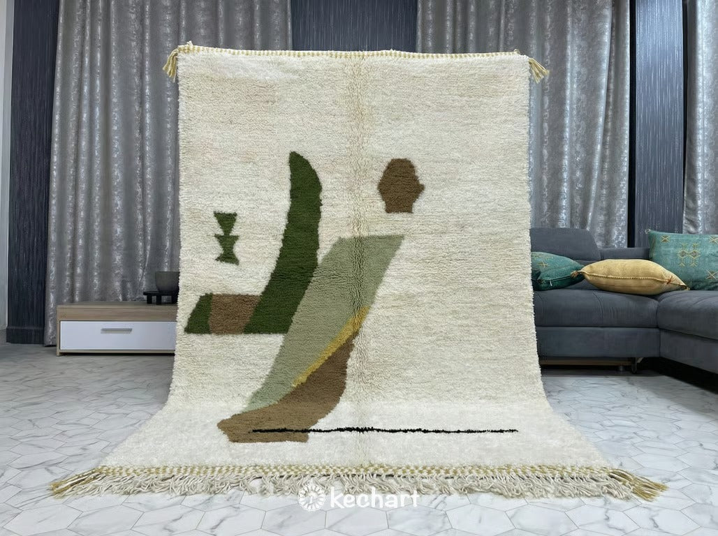 Minimalist dining space featuring a made-to-order geometric Moroccan rug in muted olive and beige tones under a wooden dining table.