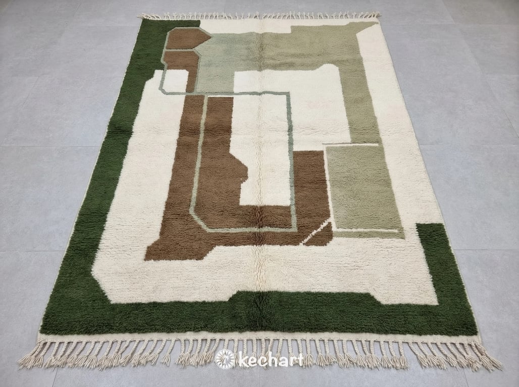 Custom made-to-order Beni Ourain Moroccan wool rug showing plush texture and traditional fringe. The pattern features geometric diamonds in a unique earth tone palette of olive grove, raw umber, classic beige, and sage green.