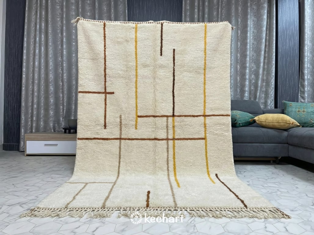 Close-up view of the thick, hand-knotted wool pile and traditional fringe of a bespoke Moroccan rug showing the rich Sierra and saffron color variations.