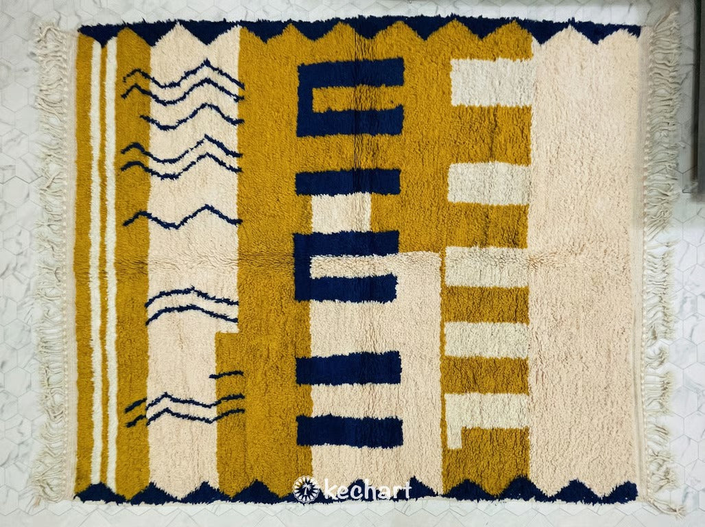 Custom made-to-order Beni Ourain Moroccan rug with plush cream wool pile and geometric diamond patterns in rust, midnight navy, and curry yellow colors.