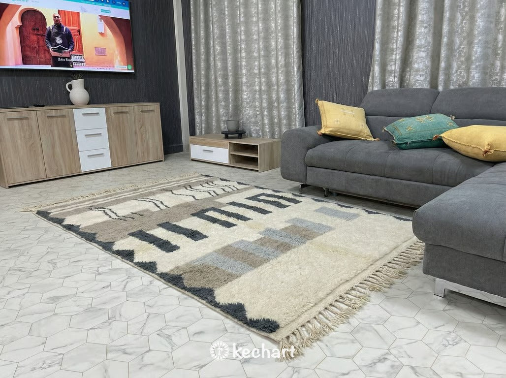 Plush Berber wool area rug in slate grey and white geometric design defining a dining area with wooden furniture, showcasing elegant Moroccan craftsmanship.